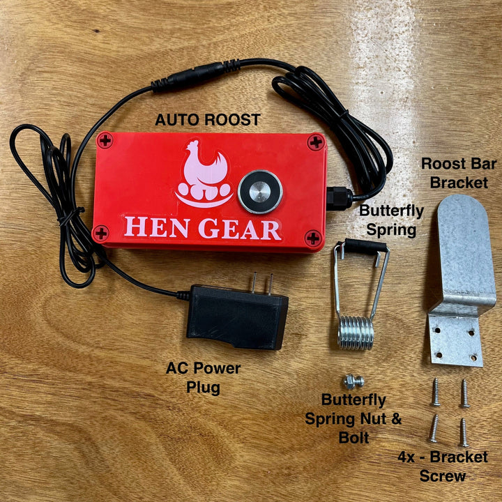 Red automatic nest box opener with AC power plug, butterfly spring, and mounting hardware by HenGear.