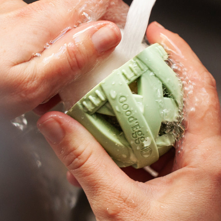 GoodEgg silicone egg washing brush in green, designed for backyard chickens, dishwasher-safe, available in standard and larg