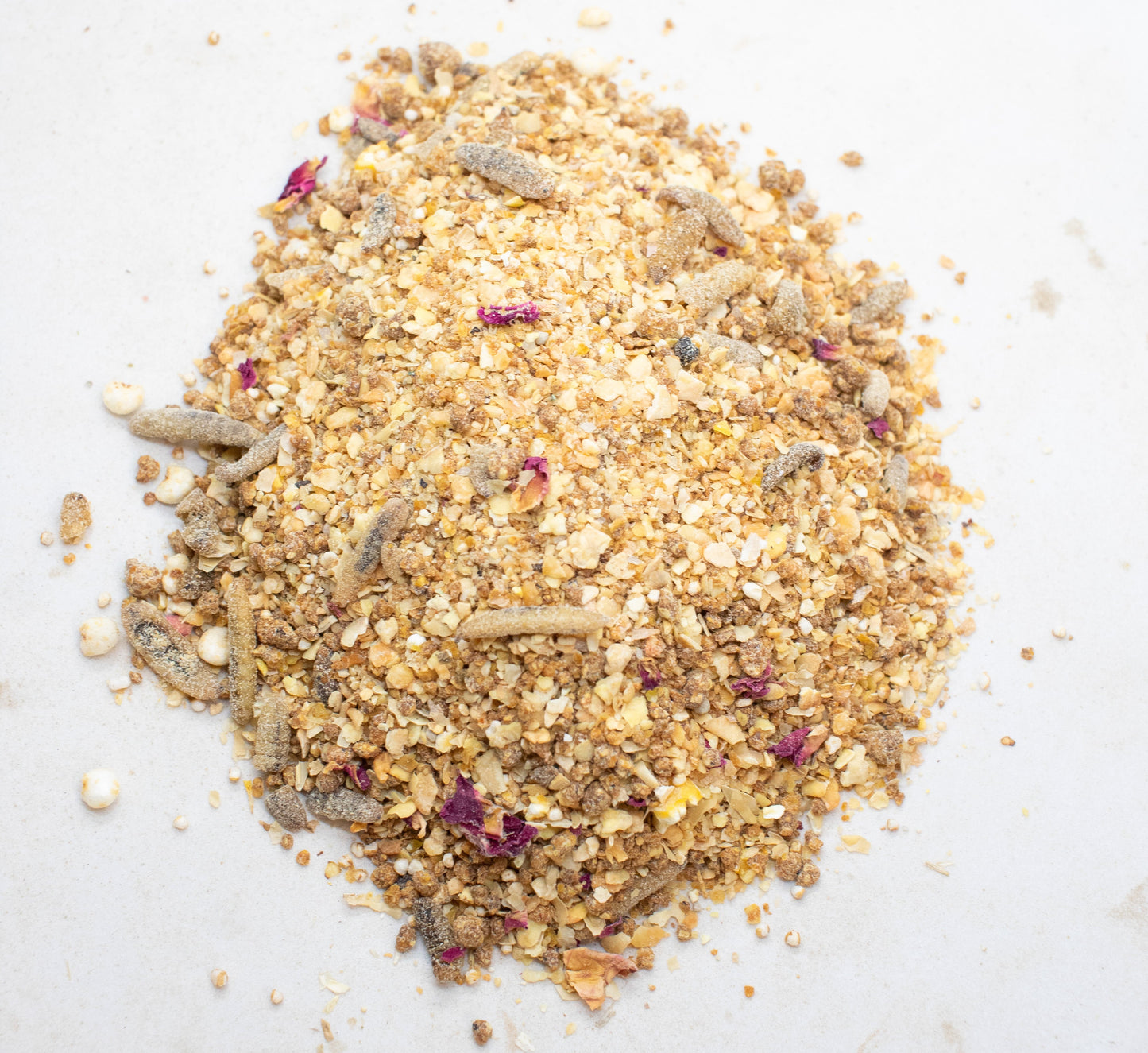 Protein-rich treat for baby chicks with mealworms, featuring a blend of grains and floral bits, from Dahlia Pets.