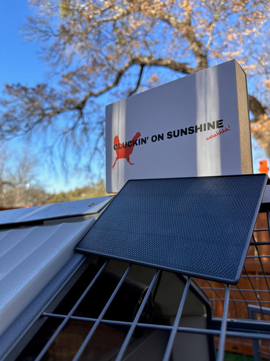 Weatherproof black solar panel for continuous power, compatible with The Smart Coop chicken coop camera.
