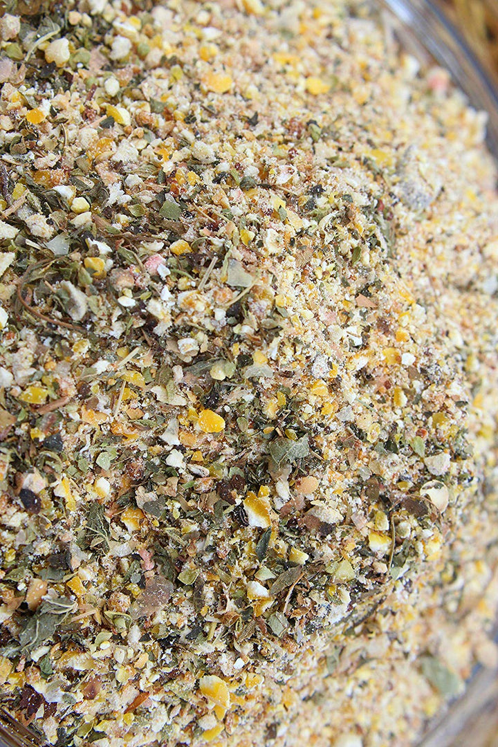 Non-GMO herbal chick starter feed blend with oregano and garlic, featuring a mix of grains and herbs, by Dahlia Pets.