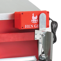 Red automatic nest box opener by HenGear with metal mounting, designed for easy access to poultry.