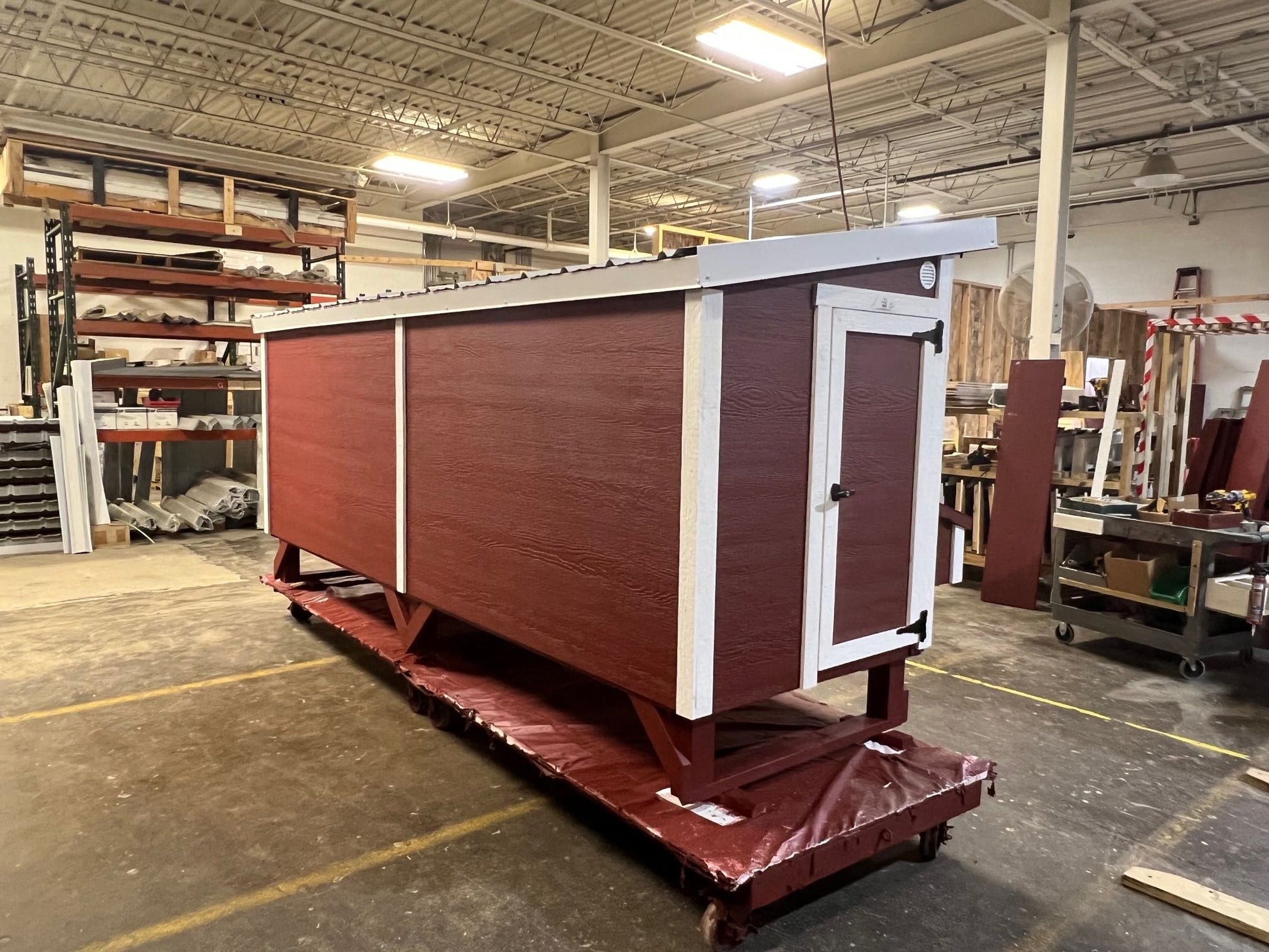 OverEZ wooden chicken coop designed for 30 chickens, featuring 10 nesting boxes and an Amish-crafted style.