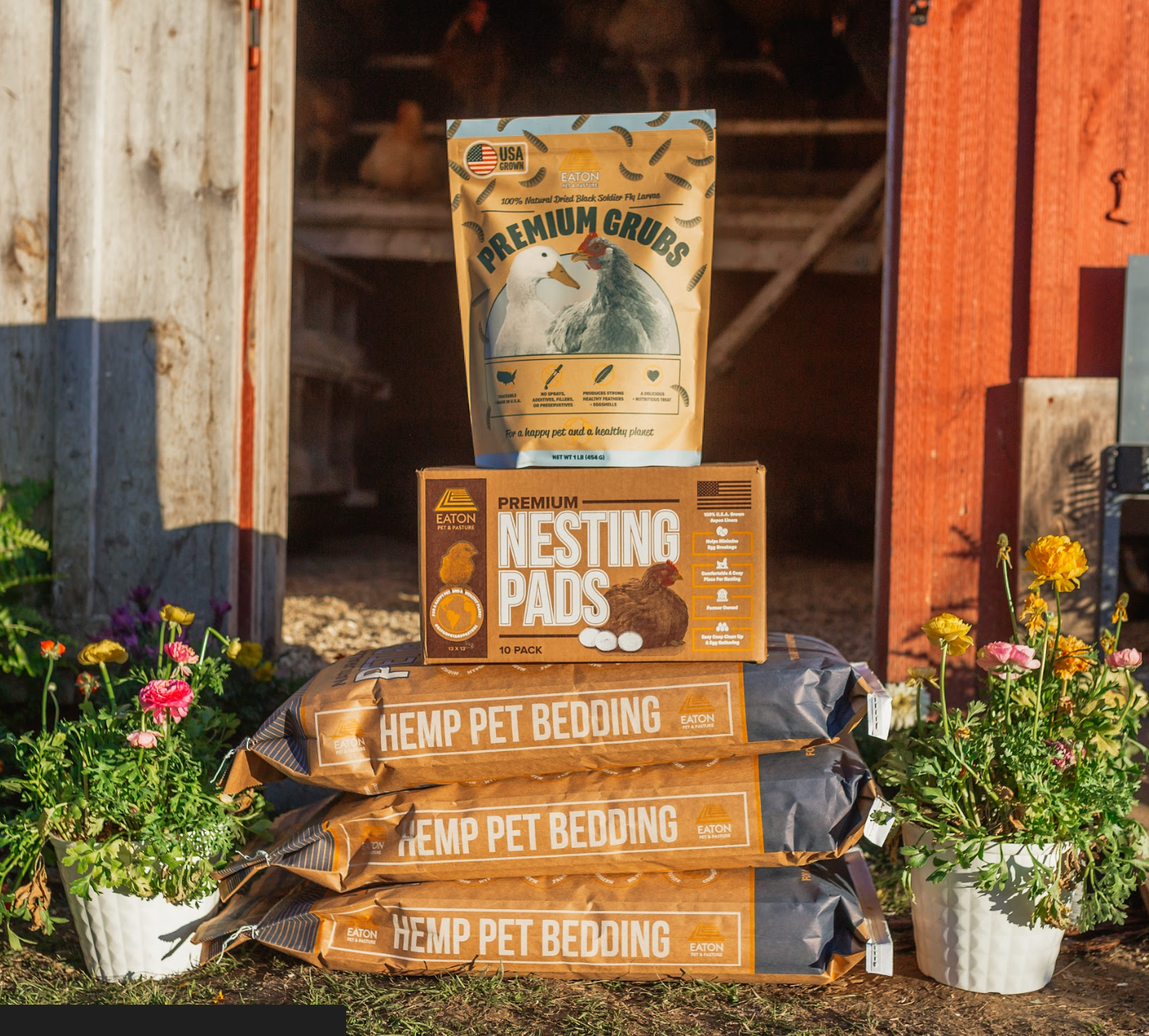 Eaton Pet and Pasture premium chicken coop bundle with hemp bedding, nesting pads, and grubs in a rustic outdoor setting.