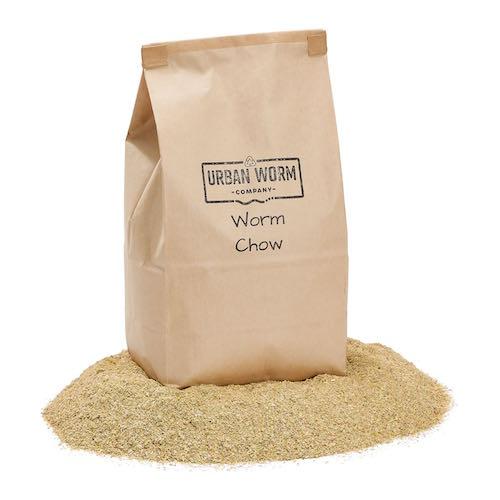 Brown protein-rich worm food in a 2lb bag from Urban Worm Company for enhancing vermicomposting.