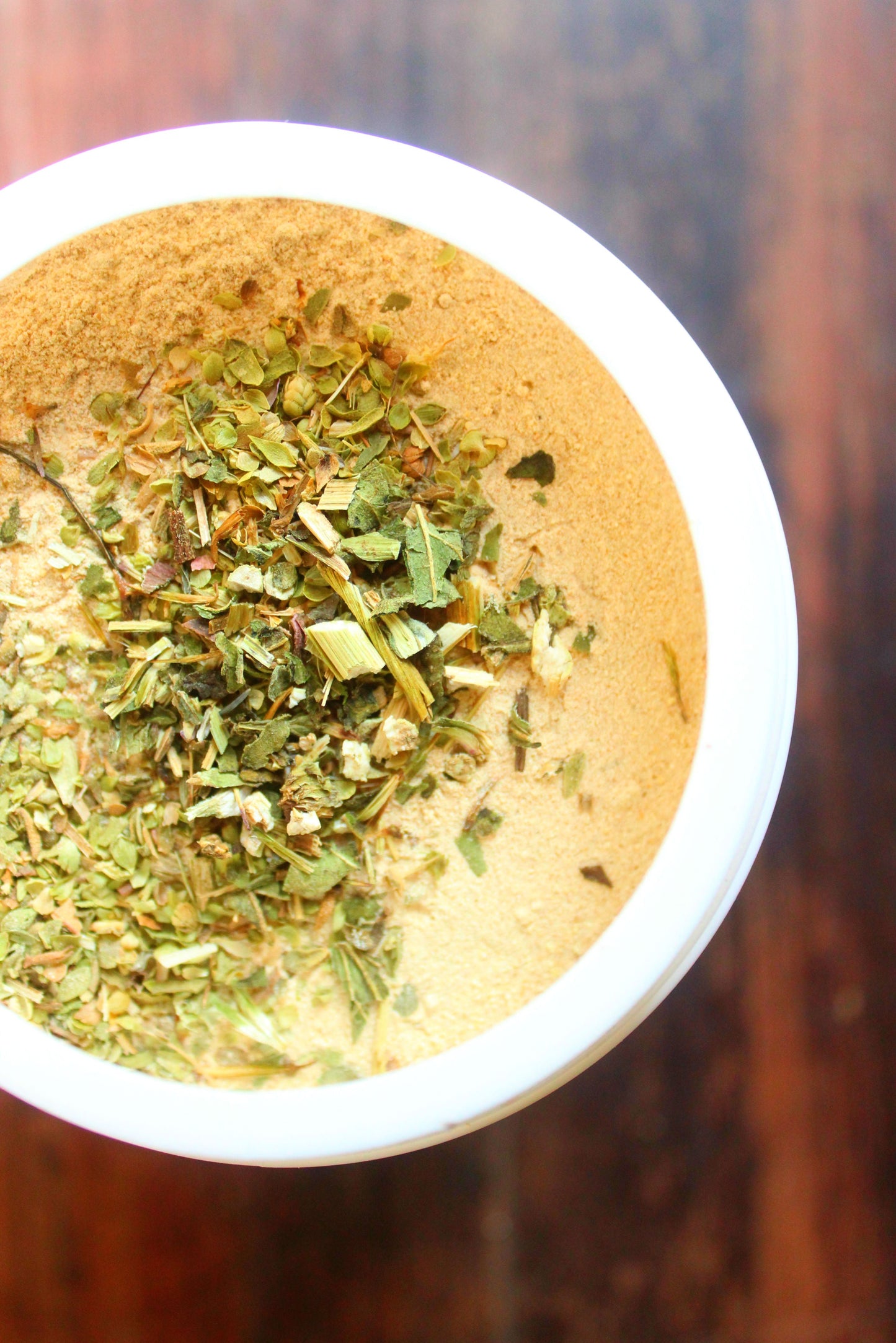 Brewer's yeast supplement for chickens and ducks, featuring a blend of herbs in a white container.