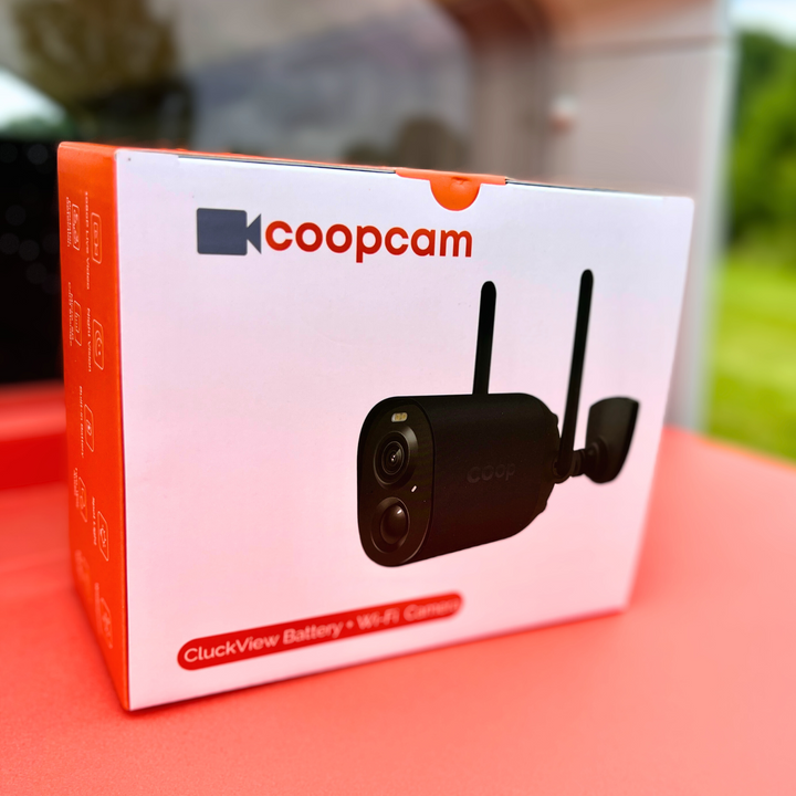 Smart CoopCam AI chicken coop camera with predator detection and dual antennas, packaged in a red and white box
