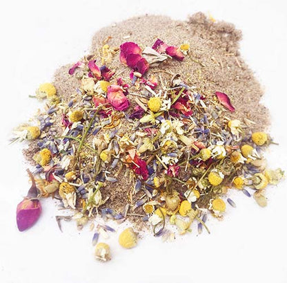 Floral dust bath herbs for chickens, featuring a blend of calendula and lavender, in a natural sand base.
