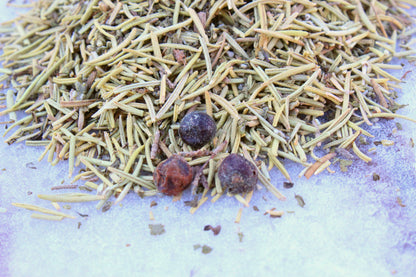 Dried herbal blend for chickens featuring rosemary and juniper berries by Dahlia Pets, ideal for coop health.