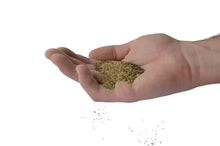 Fertrell Poultry Nutri-Balancer vitamin mineral supplement granules in a hand, suitable for all poultry types.