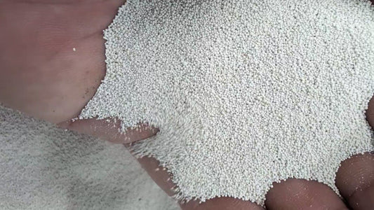 Fertrell Aragonite Pure Calcium Supplement for Poultry in green and white packaging, available in 5lb or 50lb sizes.